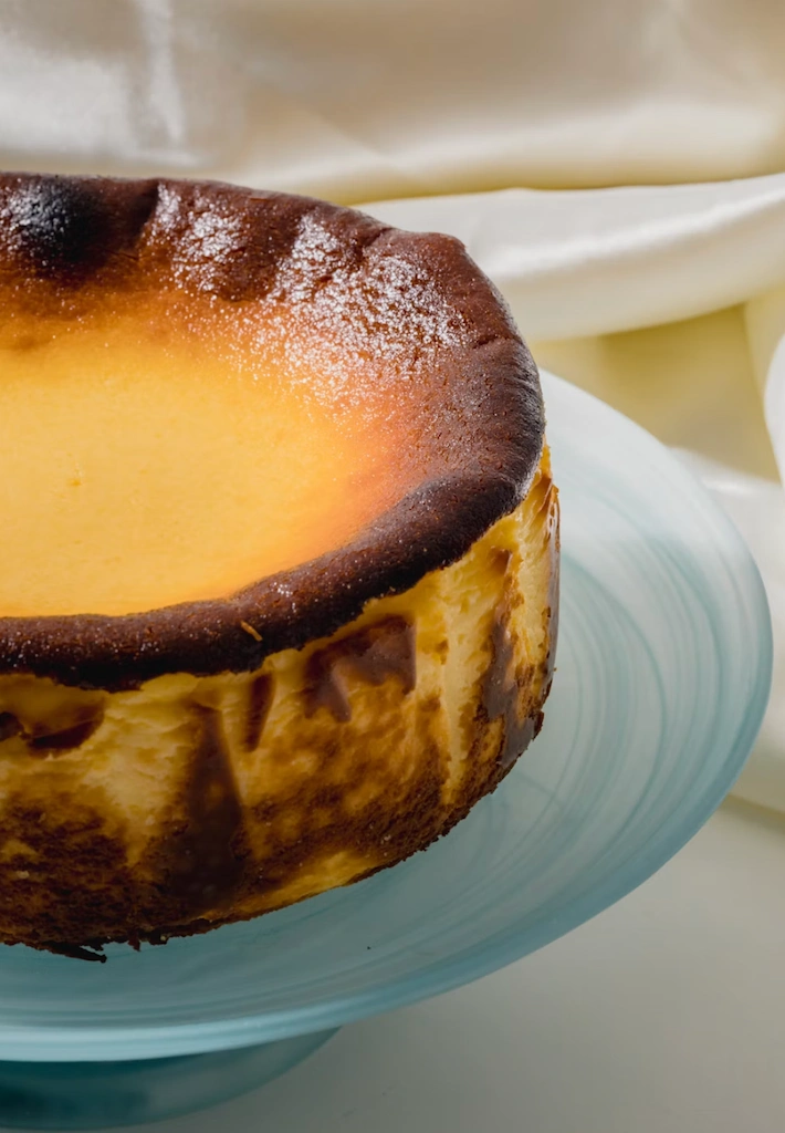 Basque burnt cheesecake with dark caramelised top and creamy custard interior