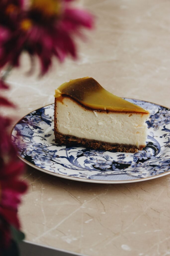 Slice of Basque cheesecake showing the burnt top and creamy interior