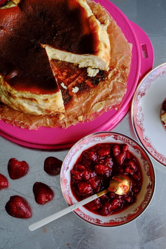 Basque cheesecake served with strawberry compote
