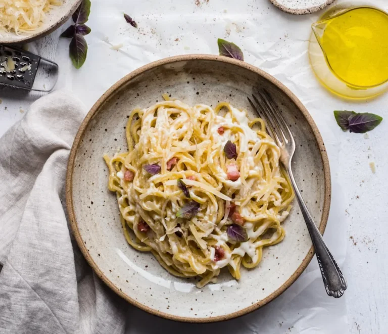 Authentic carbonara pasta with creamy egg sauce, guanciale and black pepper
