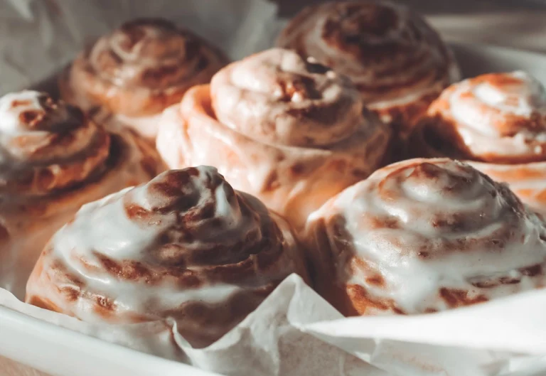 Cinnabon cinnamon rolls with cream cheese glaze poured over