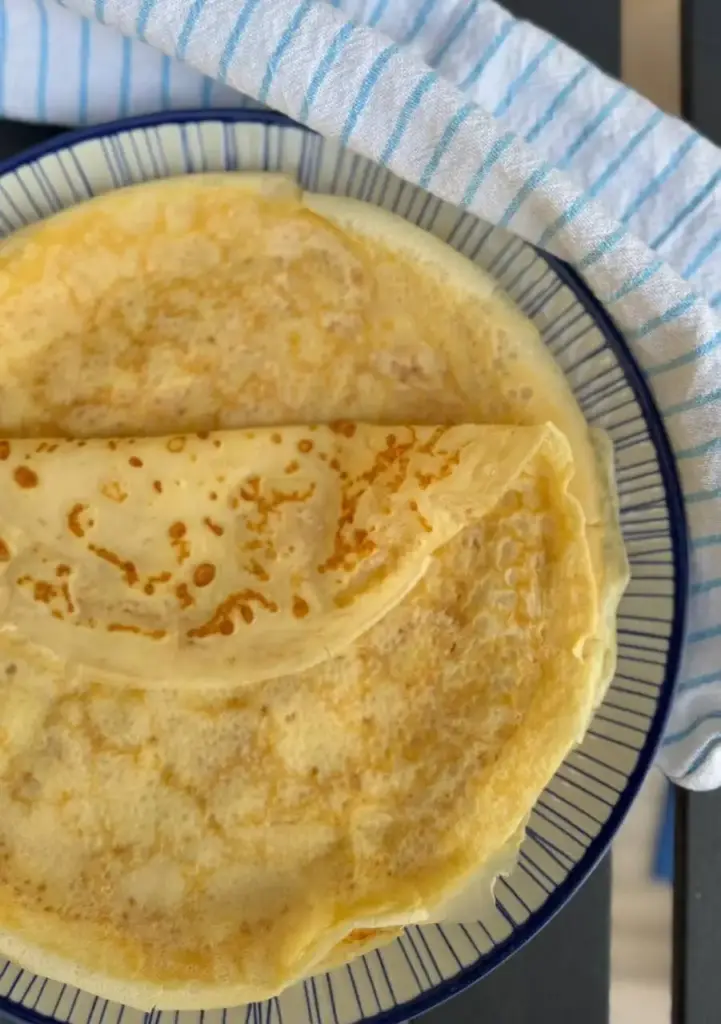 Classic French crepes folded on a plate with a light golden colour