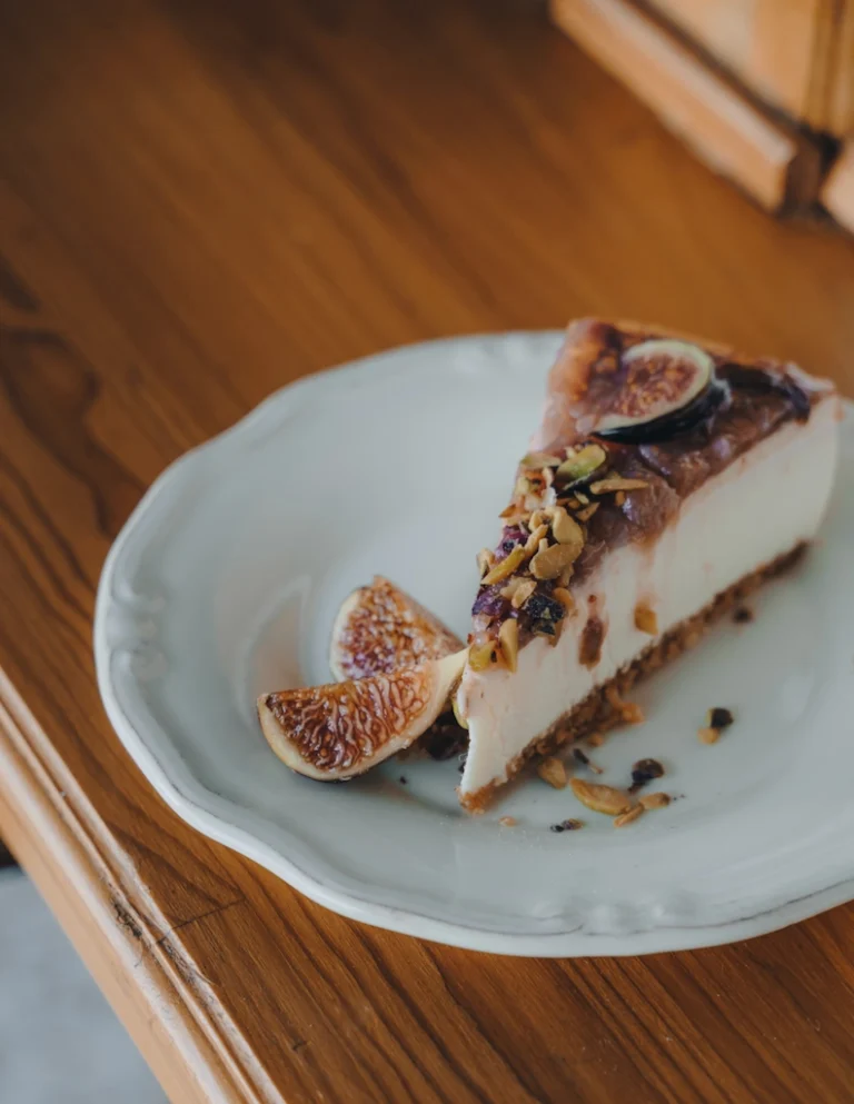 Fig hazelnut cheesecake with sliced fresh figs on top and a hazelnut crust