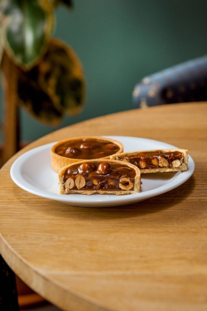Salted caramel and hazelnut tart, sliced open