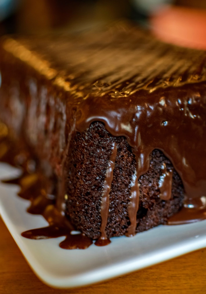 Classic sticky toffee pudding with toffee sauce poured over, served warm